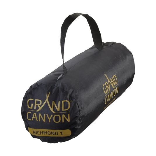 Schwarze zylindrische Reisetasche mit „Grand Canyon® Richmond 1“-Schriftzug und einem Tragegriff oben.