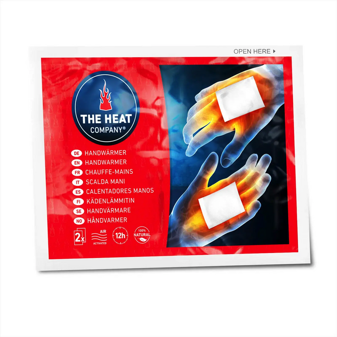 Verpackung des THE HEAT COMPANY® Handwärmers mit Darstellung der natürlichen Wärme, die von einem Paar Hände ausgeht.