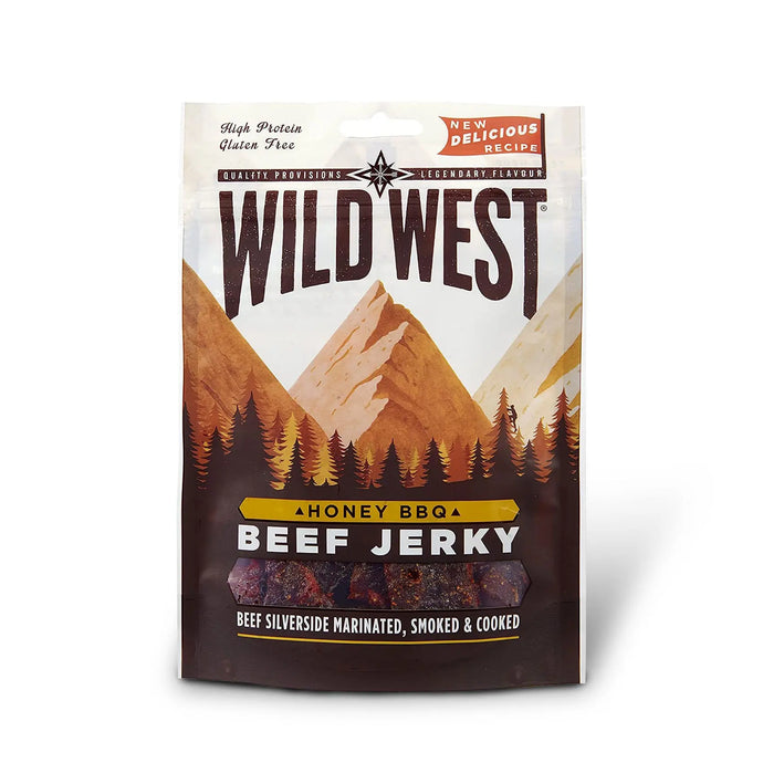 Eine Packung Wild West Jerky Honey BBQ Trockenfleisch vom Rind mit einem malerischen Bergdesign, das auf einen hohen Proteingehalt und glutenfreie Eigenschaften hinweist.