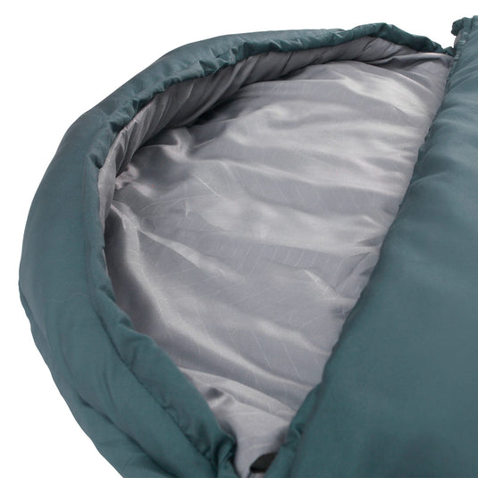 Nahaufnahme eines grünen Outwell® Schlafsacks Campion Lux Teal mit Innenstoff und Wärmeisolierung.